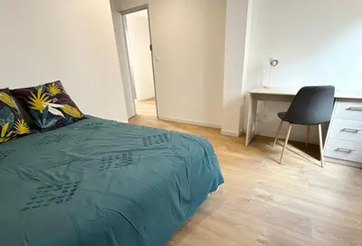 Un ou plusieurs lits dans un hébergement de l'établissement La Maisonnette de Limoges - 8 chambres