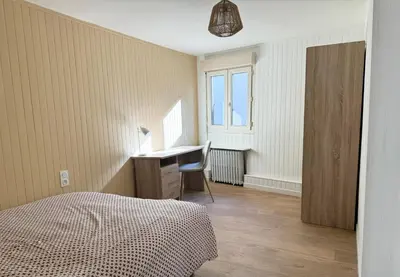 Un ou plusieurs lits dans un hébergement de l'établissement La Maisonnette de Limoges - 8 chambres