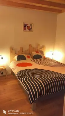 Un ou plusieurs lits dans un hébergement de l'établissement chalets du massif du Sancy