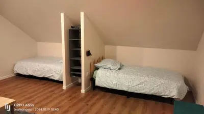 Un ou plusieurs lits dans un hébergement de l'établissement chalets du massif du Sancy