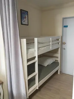 Un ou plusieurs lits dans un hébergement de l'établissement Studio 2 - Mont Dore face aux Thermes - Hyper-Centre