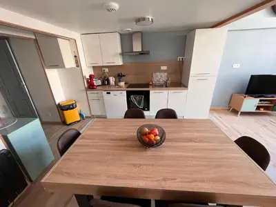 Cuisine ou kitchenette dans l'établissement Duplex La Bourboule