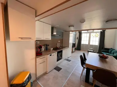 Cuisine ou kitchenette dans l'établissement Duplex La Bourboule