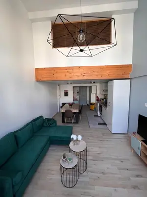 Coin salon dans l'établissement Duplex La Bourboule