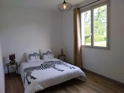 Un ou plusieurs lits dans un hébergement de l'établissement Maison plain-pied