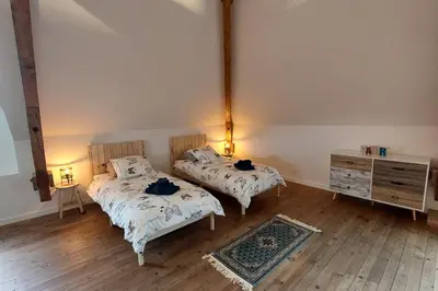 Un ou plusieurs lits dans un hébergement de l'établissement Gîte d'exception avec piscine chauffée pour 12 personnes - Cantal