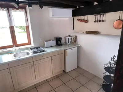 Cuisine ou kitchenette dans l'établissement Domaine Pâquerettes et Pïssenlits