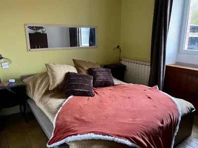 Un ou plusieurs lits dans un hébergement de l'établissement Gîte La Cahute