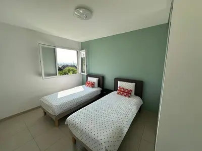Un ou plusieurs lits dans un hébergement de l'établissement Jolie Appartement T3 Brive