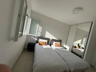 Un ou plusieurs lits dans un hébergement de l'établissement Jolie Appartement T3 Brive