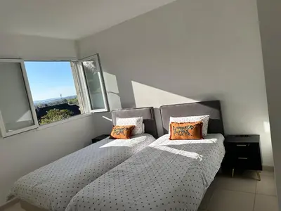 Un ou plusieurs lits dans un hébergement de l'établissement Jolie Appartement T3 Brive