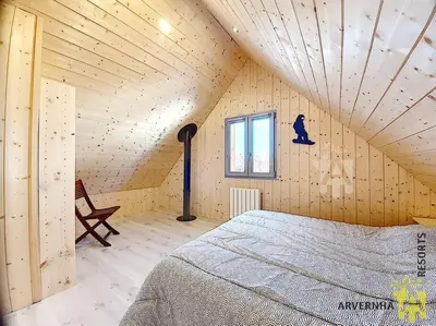 Un ou plusieurs lits dans un hébergement de l'établissement Chalet Caranne