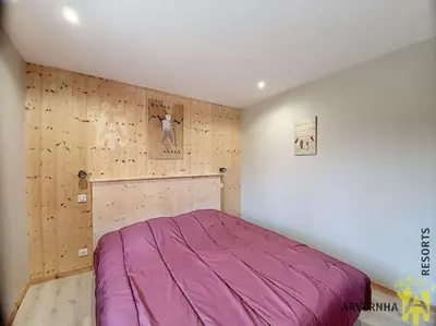 Un ou plusieurs lits dans un hébergement de l'établissement Chalet Caranne