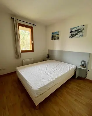 Un ou plusieurs lits dans un hébergement de l'établissement Appartement