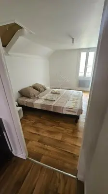Un ou plusieurs lits dans un hébergement de l'établissement appartement fontaine Saint-Martin