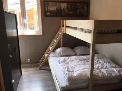 Un ou plusieurs lits dans un hébergement de l'établissement Chalet à Besse 12 personnes
