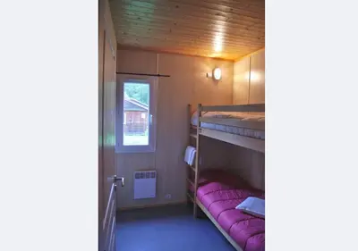 Un ou plusieurs lits dans un hébergement de l'établissement Camping La Chapelle