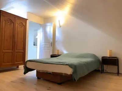 Un ou plusieurs lits dans un hébergement de l'établissement L'appartement du petit Bois