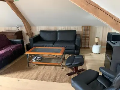Coin salon dans l'établissement L'appartement du petit Bois