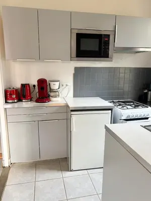 Cuisine ou kitchenette dans l'établissement La Petite Maison