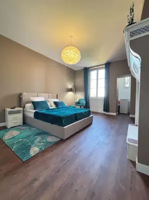 Un ou plusieurs lits dans un hébergement de l'établissement Appartement 5 Climatisé confort moderne dans un t2 chaleureux