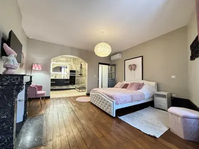 Un ou plusieurs lits dans un hébergement de l'établissement Appartement 4 Climatisé cocon romantique au cœur de Limoges