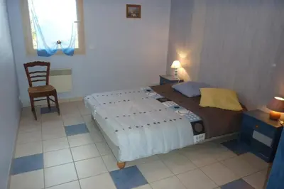 Un ou plusieurs lits dans un hébergement de l'établissement Maison spacieuse à Loubressac avec piscine privée
