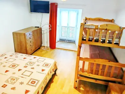 Un ou plusieurs lits dans un hébergement de l'établissement Maison proximité station de ski le lioran