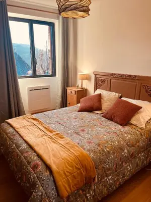 Un ou plusieurs lits dans un hébergement de l'établissement Maison authentique au cœur des montagnes, 8pers
