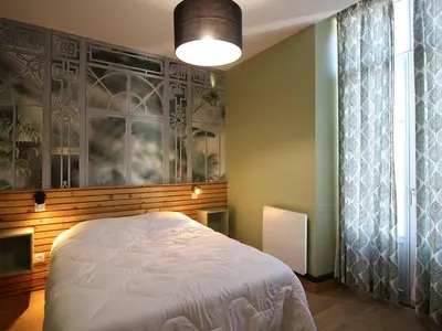 Un ou plusieurs lits dans un hébergement de l'établissement La Bourboule Appartement T2 avec WiFi près des Thermes - FR-1-608-277