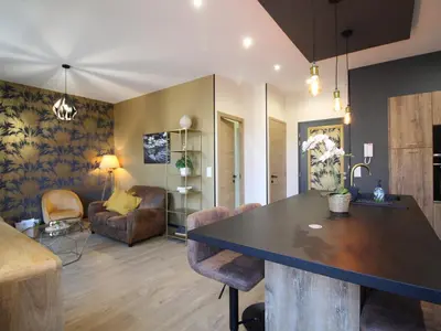 Coin salon dans l'établissement La Bourboule Appartement T2 avec WiFi près des Thermes - FR-1-608-277