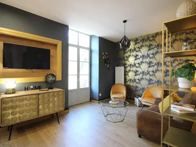 Télévision ou salle de divertissement dans l'établissement La Bourboule Appartement T2 avec WiFi près des Thermes - FR-1-608-277
