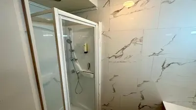 Salle de bains dans l'établissement Les Oréades Le Mont Dore 10pers