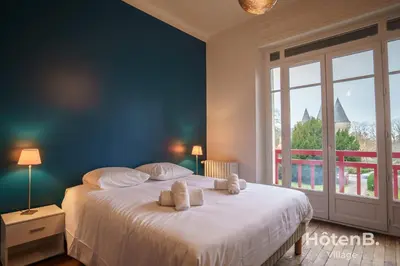 Un ou plusieurs lits dans un hébergement de l'établissement Maison Léonce Blanc - Prestige in Lubersac