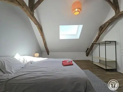 Un ou plusieurs lits dans un hébergement de l'établissement La maison de pierre