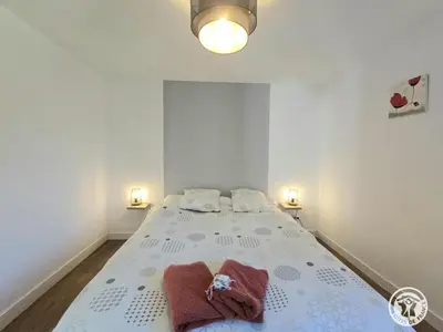 Un ou plusieurs lits dans un hébergement de l'établissement La maison de pierre