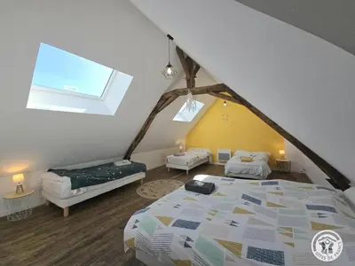 Un ou plusieurs lits dans un hébergement de l'établissement La maison de pierre