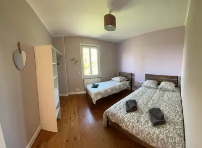 Un ou plusieurs lits dans un hébergement de l'établissement La Maison Lilas