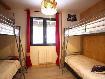 Un ou plusieurs lits dans un hébergement de l'établissement Chalet cosy pour 10 pers., terrasse spacieuse, animaux acceptés - FR-1-608-280