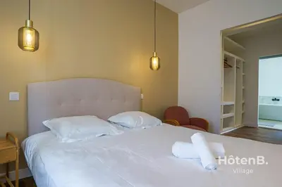 Un ou plusieurs lits dans un hébergement de l'établissement Villa de Plaisance Élégance et Confort