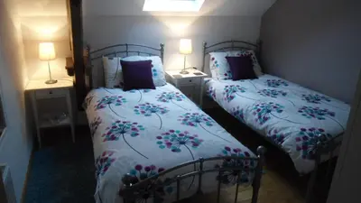 Un ou plusieurs lits dans un hébergement de l'établissement Villas de Leypinas B&B