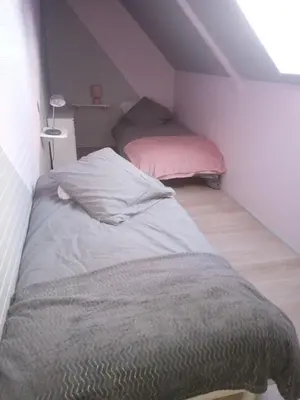 Un ou plusieurs lits dans un hébergement de l'établissement Gîte des coussières