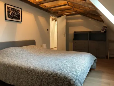 Un ou plusieurs lits dans un hébergement de l'établissement Haras de la Cour Gite 10 people