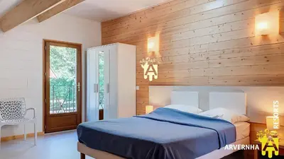 Un ou plusieurs lits dans un hébergement de l'établissement Chalet Guerêve
