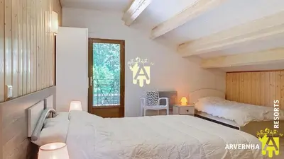 Un ou plusieurs lits dans un hébergement de l'établissement Chalet Guerêve