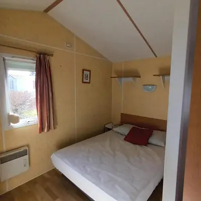 Un ou plusieurs lits dans un hébergement de l'établissement Camping Baroudeurs