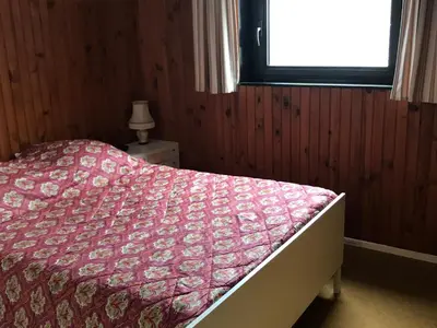 Un ou plusieurs lits dans un hébergement de l'établissement Appartement central à Super Besse, 2 chambres, proche pistes - FR-1-814-11