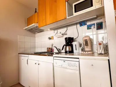 Cuisine ou kitchenette dans l'établissement Appartement 6 pers, Wi-Fi, proche pistes ski, garage privé, vue lac et montagnes - FR-1-814-24