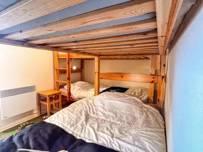 Un ou plusieurs lits dans un hébergement de l'établissement Appartement 6 pers, Wi-Fi, proche pistes ski, garage privé, vue lac et montagnes - FR-1-814-24