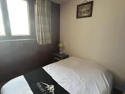 Un ou plusieurs lits dans un hébergement de l'établissement Spacieux Appartement au Pied des Pistes - FR-1-814-21